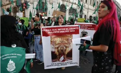  ?? Photograph: EPA-EFE ?? A rally in Lima calling for legal abortion; the poster accuses the church of violence by blocking abortion. The incest victim was convicted of self-abortion after miscarryin­g.