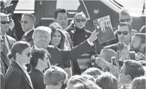  ?? KAZUHIRO NOGI/AP ?? President Trump greets the press on his trip to Asia.