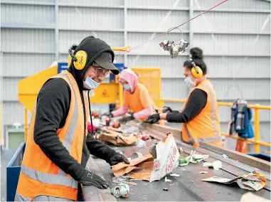  ?? DOMINICO ZAPATA/ STUFF ?? Staff sort recycling at the Waipā Recycling Centre in Te Awamutu.