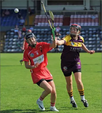  ??  ?? A midfield battle between Shelley Kehoe and Cork’s Julia White. Photograph: George Hatchell.