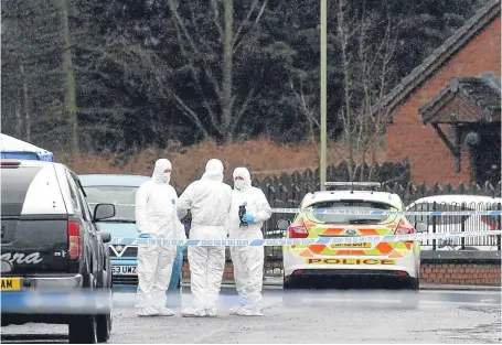  ??  ?? Forensic officers in Drumlanrig Drive in Dundee on February 26.