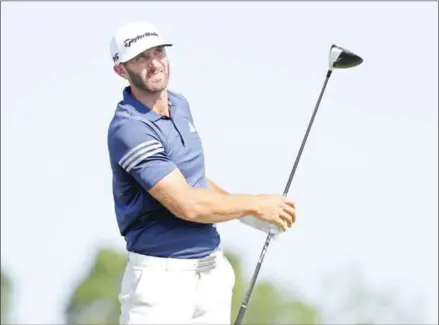  ?? STREETER LECKA/GETTY IMAGES/AFP ?? Dustin Johnson plays a shot during a practice round at Erin Hills in Wisconsin on Tuesday, prior to the 2017 US Open, which begins today.