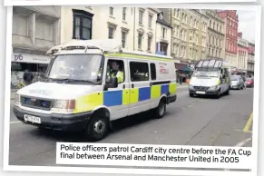  ??  ?? Police officers patrol Cardiff city centre before the FA Cup final between Arsenal and Manchester United in 2005