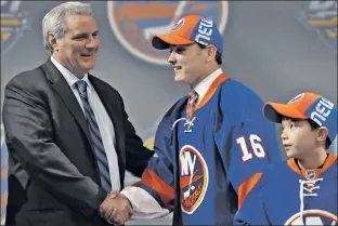  ?? Getty Images ?? SEE YA IN B’KLYN: Islanders general manager Garth Snow greets the team’s firstround pick, forward Kieffer Bellows, during Friday’s NHL Entry Draft in Buffalo.