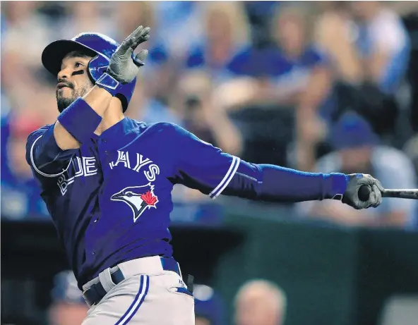  ?? — THE CANADIAN PRESS FILES ?? Toronto Blue Jays second baseman Devon Travis says he’s recovering well from a bone bruise related to knee surgery during the off-season. ‘My knee is going to tell me when I’m ready to go, and it’s starting to tell me I’m ready to go,’ he says.
