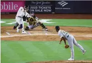  ?? Al Bello / Getty Images ?? The Yankees’ Oswaldo Cabrera connects for a first-inning grand slam against the Pirates.