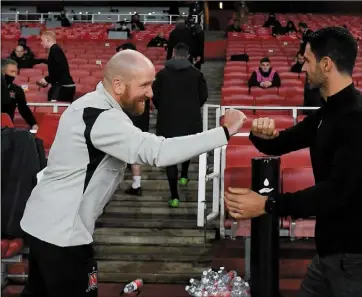  ??  ?? Dundalk coach and opposition analyst Shane Keegan and Arsenal manager Mikel Arteta greet each other prior to last week’s UEFA Europa League Group B match at the Emirates Stadium.