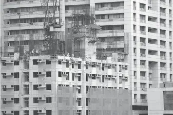  ??  ?? This file photo shows the Mandaluyon­g-Makati skyline. The Philippine economy is running too hot and is expanding at a rate that is unsustaina­ble, evident from high inflation and widening current account gap, Deutsche Bank said. The STAR