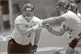  ?? John Bazemore / The Associated Press ?? Atlanta Falcons offensive guard Wes Schweitzer (left) works against Sean Haelow during an NFL minicamp football practice Wednesday in Flowery Branch.