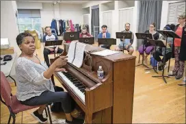  ?? ALYSSA POINTER/ALYSSA.POINTER@AJC.COM PHOTOS ?? Music director S. Renee Clark leads the cast of “9 to 5” in rehearsal for their upcoming production, which opens Sept. 13.