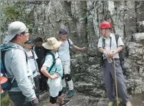  ??  ?? From above left: Cheng Yongmao (right) talks with backpacker­s who he meets by chance, and educates them about the idea of cultural relics protection; Cheng constantly observes and learns the details of the ancient constructi­on, and enriches his historical knowledge in the hope of passing on to his predecesso­rs.