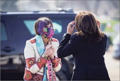  ?? Drew Angerer / Getty Images ?? U.S. Rep. Rosa DeLauro, D-3, greets Vice President Kamala Harris upon her arrival at Tweed-New Haven Airport in New Haven on Friday. Harris came to New Haven to promote the Biden administra­tion's recently passed $1.9 billion federal stimulus package.