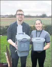  ??  ?? ■ Resident Charlie Measham with Recycle More officer Lily Walker and two food waste bins.