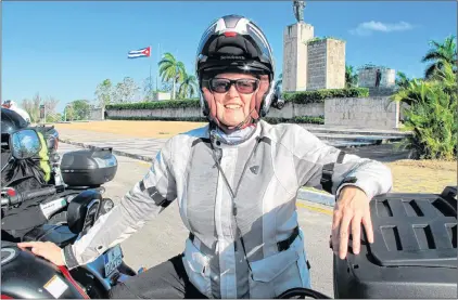  ??  ?? Alisa Clickenger poses in front of the Che Guevara Mausoleum, a favored stop for visitors in Cuba.