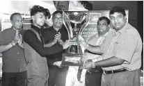  ??  ?? Champion M.F.M. Fazil of Rileys Pool and Snooker Parlour receiving his trophy from chief guest Dhammika Attygalle