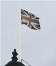  ??  ?? The Union Flag at half-mast over the town hall in 2014, to mark the 100th anniversar­y of the Bombardmen­t.