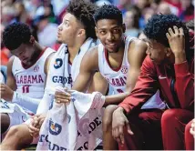  ?? VASHA HUNT/ASSOCIATED PRESS ?? Alabama star freshman forward Brandon Miller, center, talks with his teammates during his team’s game against Georgia on Saturday in Tuscaloosa, Alabama.