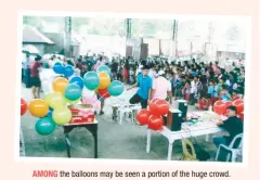  ??  ?? AMONG the balloons may be seen a portion of the huge crowd.