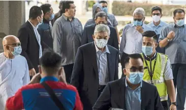  ??  ?? Court date: ahmad Zahid (centre) arriving at the Kuala lumpur High Court. — Bernama