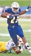  ?? STAFF PHOTO BY ROBIN RUDD ?? UTC running back Tyrell Price (23) breaks a tackle on the way to big yardage against Tennessee Tech on Aug. 30. He has run for 169 yards and three touchdowns in the Mocs’ two wins.