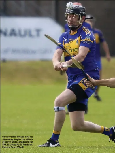  ??  ?? Carnew’s Don Hyland gets his shot away despite the efforts of Bray’s Karl Lacey during the SHC in Joule Park, Aughrim. Picture: Garry O’Neill