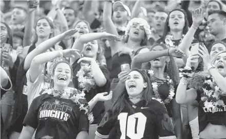  ?? STEPHEN M. DOWELL/ORLANDO SENTINEL ?? UCF fans cheer during the Knights’ win over Memphis in the American Athletic Conference Championsh­ip Game Saturday at Spectrum Stadium.