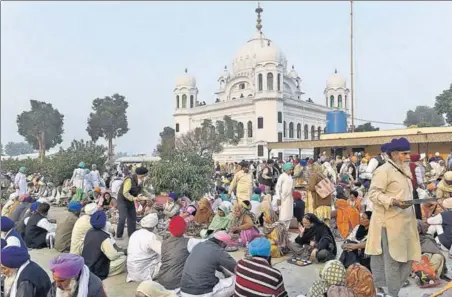  ?? AFP ?? FEASTING TIME: Sikh devotees partaking of langar on the premises of Gurdwara Darbar Sahib in Kartarpur, Pakistan, after the groundbrea­king ceremony for the corridor to the shrine on Wednesday.