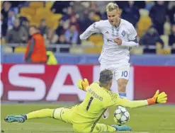  ??  ?? KIEV: Benfica goalkeeper Ederson makes a save in front of Kiev’s Andriy Yarmolenko during the Champions League Group B soccer match between Dynamo Kiev and Benfica at the Olympiyski­y stadium in Kiev, Ukraine, yesterday. — AP