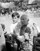  ?? ?? Pablo Picasso and his son Claude during a bull fight in Vallauris, France, in August 1954. Photograph: Jean Meunier/Interconti­nentale/AFP/Getty Images