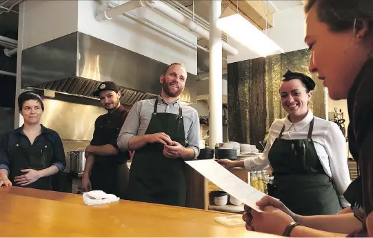  ?? EZRA SOIFERMAN ?? When he was considerin­g where to restart his career after time away from Canada, John Winter Russell settled on Montreal. “The city has amazing people that love to go out and give everybody a chance to show what they’ve got,” says the chef, shown above conferring with the staff at Candide.