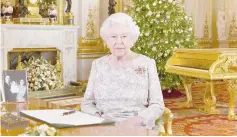  ??  ?? Queen Elizabeth II poses for a photograph after she recorded her annual Christmas Day message, in the White Drawing Room of Buckingham Palace. — AFP photo