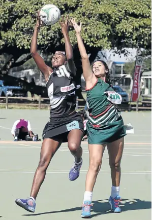  ?? /REG CALDECOTT/GALLO IMAGES ?? Melandi Pretorius of North West (right) and Jessica Khomo of KZN in action during the opening day of the Spar national championsh­ips inDurban yesterday.