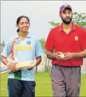  ?? HT PHOTO ?? Harmanpree­t Kaur with coach Yadwinder Singh Sodhi.