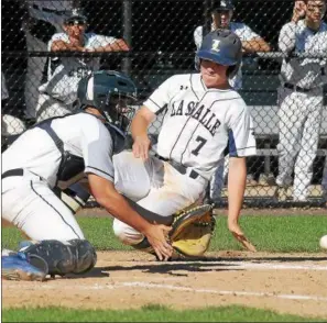  ?? GENE WALSH — DIGITAL FIRST MEDIA ?? La Salle’s Anthony Cossetti slides into home as Bensalem’s Scott Rooney fields the throw.