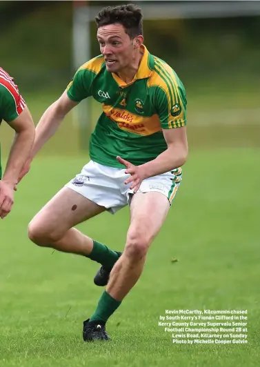  ??  ?? Kevin McCarthy, Kilcummin chased by South Kerry’s Fionán Clifford in the Kerry County Garvey Supervalu Senior Football Championsh­ip Round 2B at Lewis Road, Killarney on Sunday Photo by Michelle Cooper Galvin