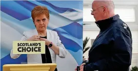  ??  ?? Preparing her speech: Miss Sturgeon and husband Peter Murrell