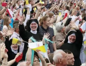  ?? CZAREK SOKOLOWSKI — THE ASSOCIATED PRESS ?? Faithful cheer Pope Francis in front of the Jasna Gora shrine in Czestochow­a, Poland, Thursday.