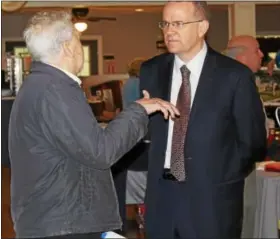  ?? MICHILEA PATTERSON — DIGITAL FIRST MEDIA ?? State Rep. Tom Quigley, R-146th Dist. talks with a man during the Healthy Lifestyles Expo at SunnyBrook Ballroom in Lower Pottsgrove May 5. Quigley organizes the annual event.