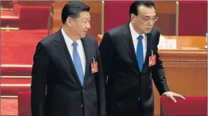  ?? Picture: AFP ?? ALL OPTIMISM: Chinese President Xi Jinping, left, and Premier Li Keqiang attend the third plenary session of the 12th National People’s Congress at the Great Hall of the People in Beijing