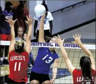  ?? Arkansas Democrat-Gazette/MITCHELL PE MASILUN ?? East All-Star Kennedy Sellers (center) of Nettleton spikes the ball between the West’s Klaire Trainor (left) of Springdale Har-Ber and Faith Waitsman of Fayettevil­le during Wednesday’s all-star volleyball game at the Farris Center in Conway. The West...