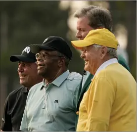  ?? GREGORY BULL — THE ASSOCIATED PRESS ?? From left, Gary Player, Lee Elder, Fred Ridley, chairman of Augusta National Golf Club and the Masters Tournament and Jack Nicklaus pose after the ceremonial first tees during the first round of the Masters golf tournament on Thursday in Augusta, Ga.