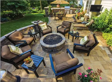  ?? PHOTO COURTESY OF METRO CREATIVE CONNECTION ?? Build a fire pit right into the design with the same materials used to create the patio.