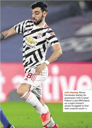  ??  ?? Left chasing: Bruno Fernandes battles for possession with Crystal Palace’s Luka Milivojevi­c on a night United’s attack struggled to find their creative touch
PA