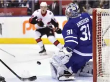  ?? FRANK GUNN/THE CANADIAN PRESS ?? A shot from Ottawa’s Thomas Chabot beats Leafs goalie Frederik Andersen with Ryan Dzingel of the Senators on the doorstep in the first period.