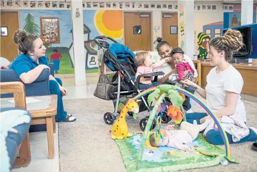  ?? WHITNEY CURTIS PHOTOS/WASHINGTON POST ?? From left: inmates Destiny Doud, LaTonya Jackson and Christine Duckwitz play with their daughters at Decatur Correction­al Center in Illinois.