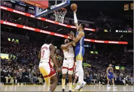  ?? THEARON W. HENDERSON — GETTY IMAGES ?? Patrick Baldwin Jr. (7) of the Golden State Warriors shoots over Kenyon Martin Jr. (6) of the Houston Rockets during the fourth quarter at Chase Center on Friday in San Francisco.