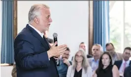  ?? DAVE SIDAWAY ?? Premier Philippe Couillard said his government has created committees to work on improving access to education and health-care services in English.
