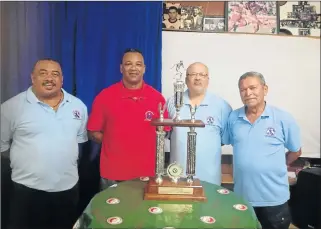  ??  ?? FOR THE LOVE OF FOOTBALL: Premier Top 8 sponsor Mark Alexander, second from left, shows off the trophy with East London Central executive members Gavin van Rooyen, left, Calvin Brown and Allan van der Hoven at the launch of the fourth edition of the...