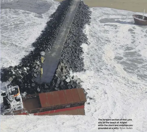  ?? Picture: Reuters ?? The forward section of the Luno sits on the beach at anglet while the stern and midships are grounded on a jetty