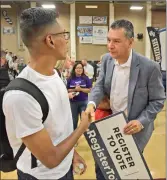  ?? Dan Watson /The Signal ?? (Above) Andrew Oh, 15, interviews Alex Padilla, left, California secretary of state, for GVTV during Padilla’s visit to Golden Valley High School on Wednesday. (Left) Student Wilmar Alas, 17, left, shakes hands with Padilla
